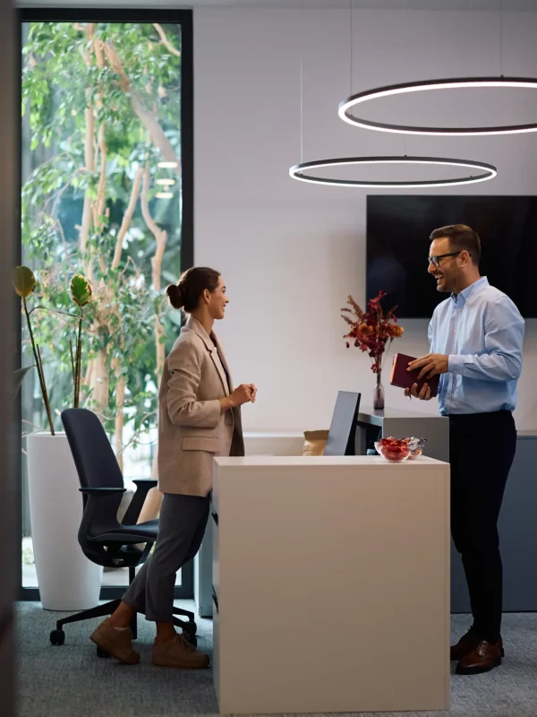 happy-business-colleagues-talking-while-working-in-2024-12-13-18-18-31-utc