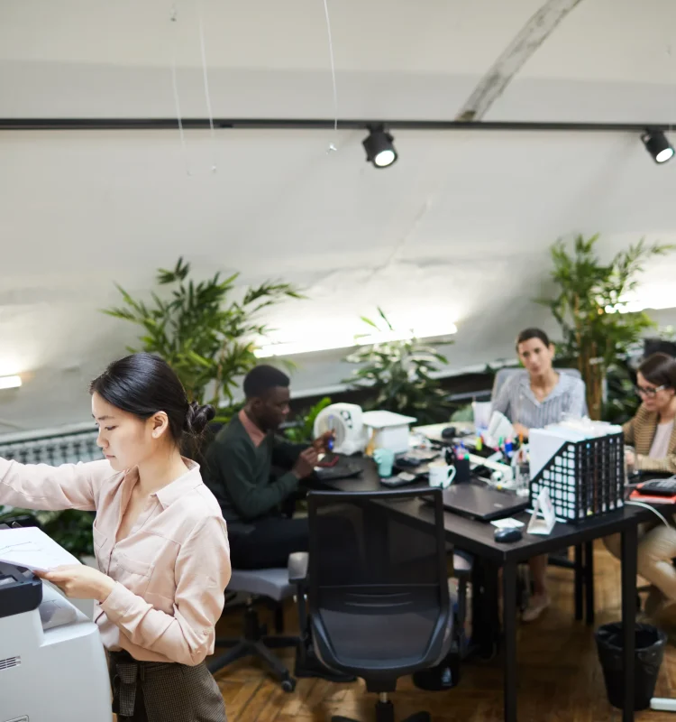 young-businesswoman-printing-documents-in-office-2025-03-10-00-07-13-utc